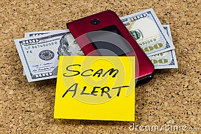 Scam alert online computer cell phone financial security threat Stock Photo