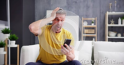 Scam Text Message. Frustrated Confused Man Stock Photo