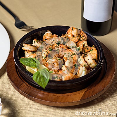 Scampi shrimp meal in the black pot plate Stock Photo