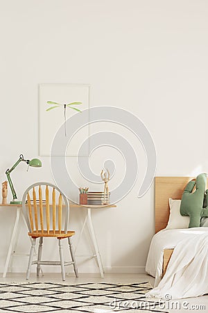 Scandinavian interior design for kids, bedroom and workspace with desk and bed Stock Photo