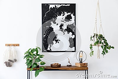 Scandinavian living room with wooden console table and map poster. Stock Photo