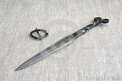 Scandinavian medieval knife, double-edged. all-metal. Stock Photo