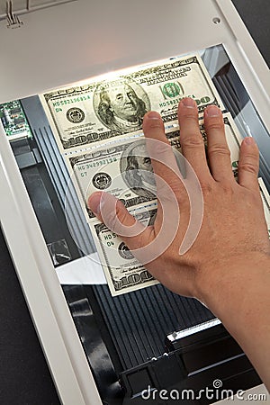 Scanner and dollar Stock Photo