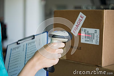 Scanning boxes with barcode scanner Stock Photo