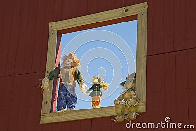 Scarecrows in a Window Stock Photo