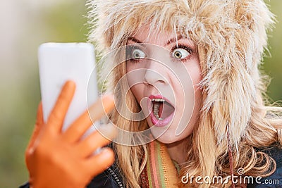 Scared afraid woman talking on mobile phone. Stock Photo