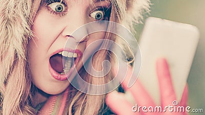 Scared afraid woman talking on mobile phone. Stock Photo