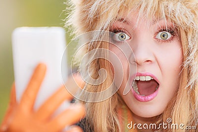 Scared afraid woman talking on mobile phone. Stock Photo