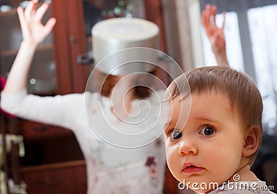 Scared baby against crazy mother Stock Photo