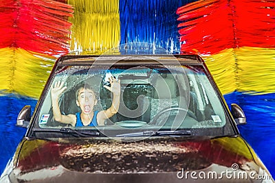 Scared boy forgotten in car in washing machine screaming for help Stock Photo