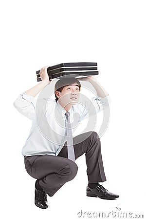 Scared businessman with briefcase Stock Photo