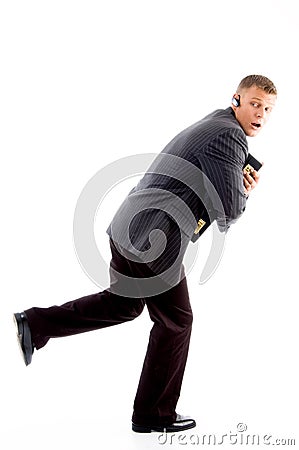 Scared businessman running Stock Photo