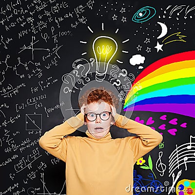 Scared child boy with ginger hair and glasses on lightbulb, science and arts scetch background. Stock Photo