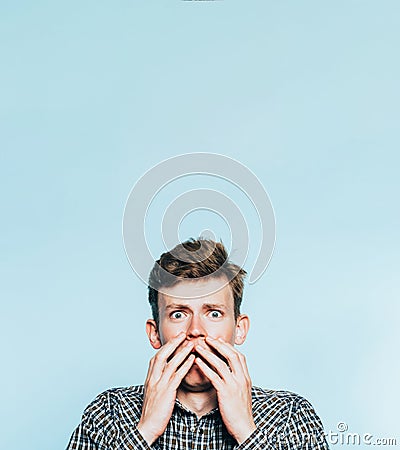 Scared emotional shocked terrified disturbed man Stock Photo