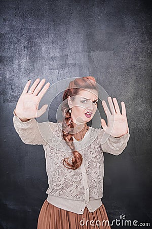 Scared funny teacher on the chalkboard background Stock Photo