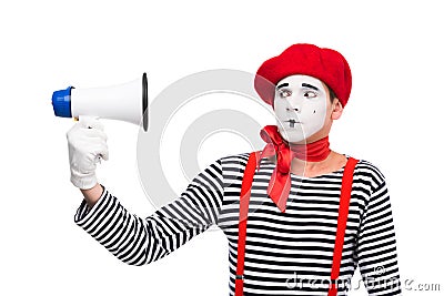 scared mime looking at megaphone Stock Photo