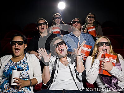 Scared movie spectators Stock Photo