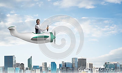 Scared pilot with open mouth in airplane Stock Photo