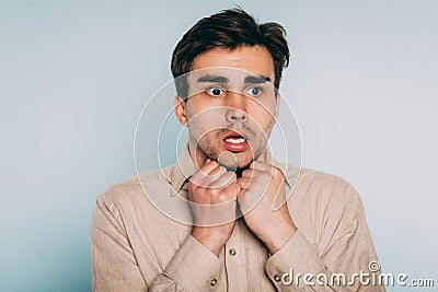 Scared shocked terrified startled man hand emotion Stock Photo