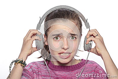 Scared teenager girl with headphones Stock Photo