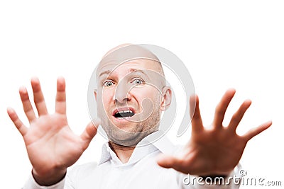 Scared or terrified businessman hand gesturing hide face stop sign Stock Photo