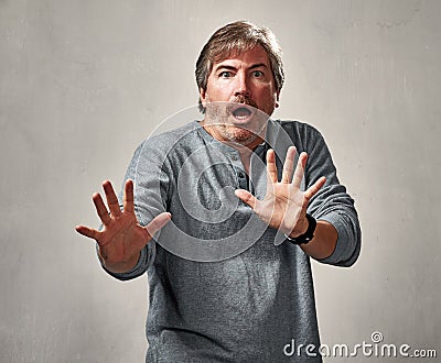 Scared threatened man Stock Photo