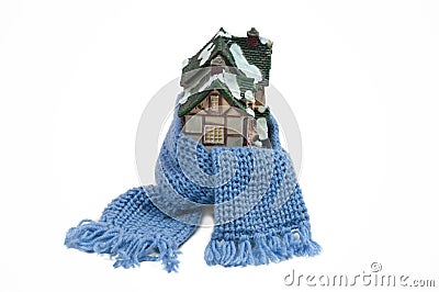 Scarf around a miniature christmas house (conceptu Stock Photo