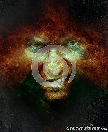 Scary angry male face over hell fire Stock Photo