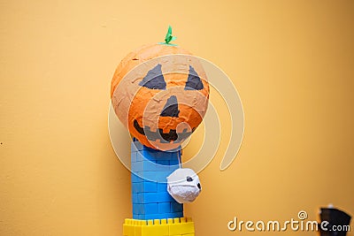 Scary artificial pumpkin decoration in the kids club during Halloween Stock Photo