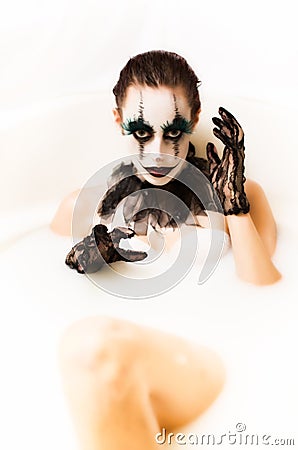 Scary clown milk bath Stock Photo