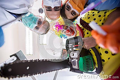 Scary delusion with dental team and clown in bottom view Stock Photo