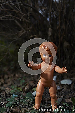 Scary doll. Child abuse. Crime scene Stock Photo