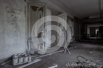 Scary empty dark corridor in an abandoned building. Shabby walls. Stock Photo