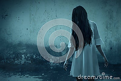 Scary ghost woman in haunted house Stock Photo