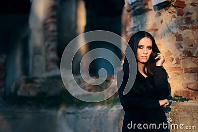 Mysterious Evil Vampire in Front of a Horror Abandoned House Stock Photo