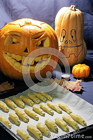 Scary happy Halloween baking finger cookies with pumpkin seeds Stock Photo