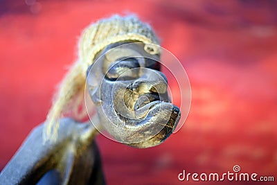 Scary-looking carved wooden sculpture Stock Photo