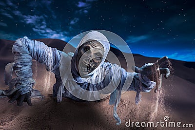 Scary mummy in a desert at night Stock Photo