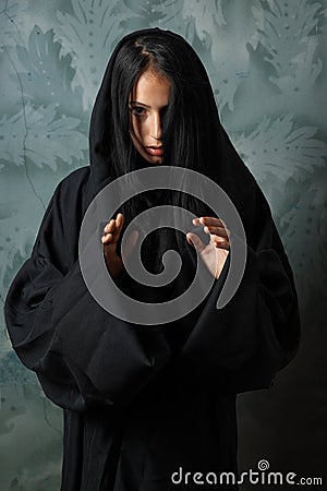 Scary nun in a cape Stock Photo