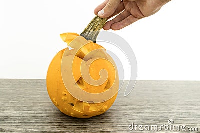 Scary orange halloween pumpkin on a wood table Stock Photo