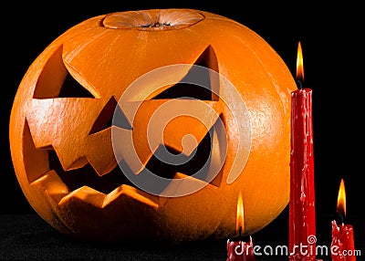 Scary pumpkin, jack lantern, pumpkin halloween, red candles on a black background, halloween theme, pumpkin killer Stock Photo