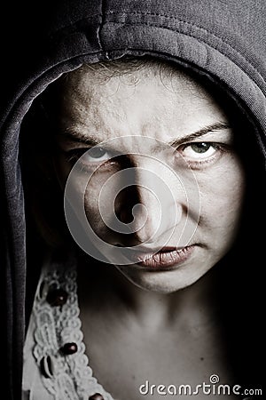 Scary sinister woman with spooky evil eyes Stock Photo