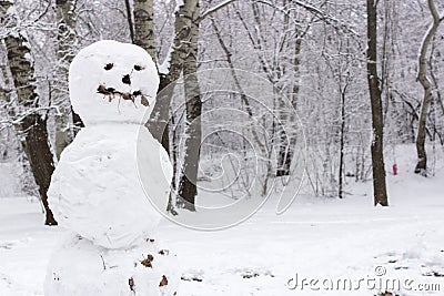 Scary snowman in the winter forest Stock Photo