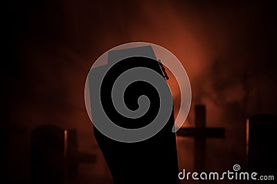 Scary view of zombies at cemetery dead tree moon church and spooky cloudy sky with fog Horror Halloween concept with glowing Stock Photo