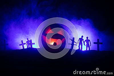 Scary view of zombies at cemetery dead tree, moon, church and spooky cloudy sky with fog, Horror Halloween concept with glowing pu Stock Photo