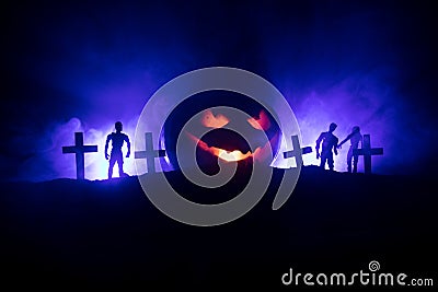 Scary view of zombies at cemetery dead tree, moon, church and spooky cloudy sky with fog, Horror Halloween concept with glowing pu Stock Photo