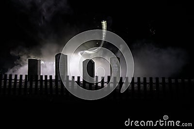 Scary view of zombies at cemetery dead tree, moon, church and spooky cloudy sky with fog, Horror Halloween concept with glowing Stock Photo