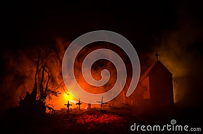 Scary view of zombies at cemetery dead tree, moon, church and spooky cloudy sky with fog, Horror Halloween concept Stock Photo