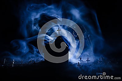 Scary view of zombies at cemetery dead tree, moon, church and spooky cloudy sky with fog, Horror Halloween concept Stock Photo