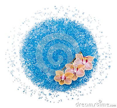Scattered blue bath salt with orchid flower Stock Photo